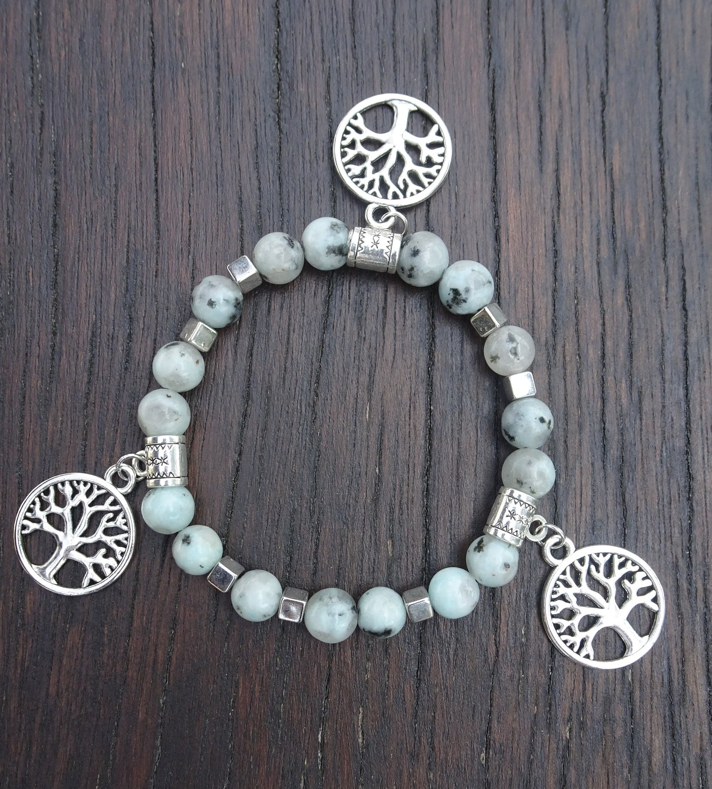 Bracelet perles naturelles 8mm bleu clair mouchetées de noir - BR150