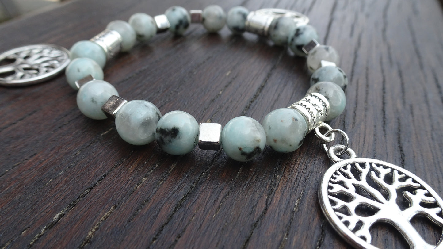 Bracelet perles naturelles 8mm bleu clair mouchetées de noir - BR150