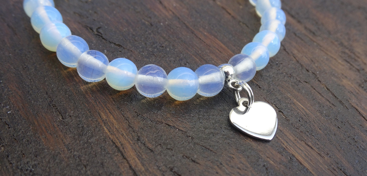 Bracelet perles naturelles 6 mm opalescentes aux reflets bleutés - BR188