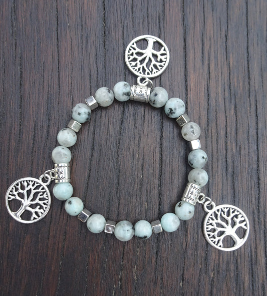 Bracelet perles naturelles 8mm bleu clair mouchetées de noir - BR150