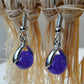Boucles d'oreilles perle naturelle violette posée sur étrier argenté - BO072